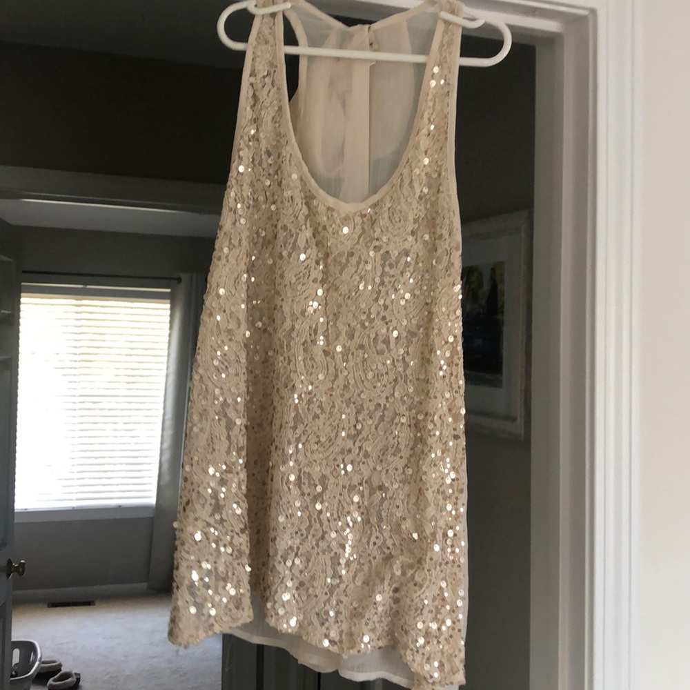 Daytrip gold sparkly tank top with bow on the back
